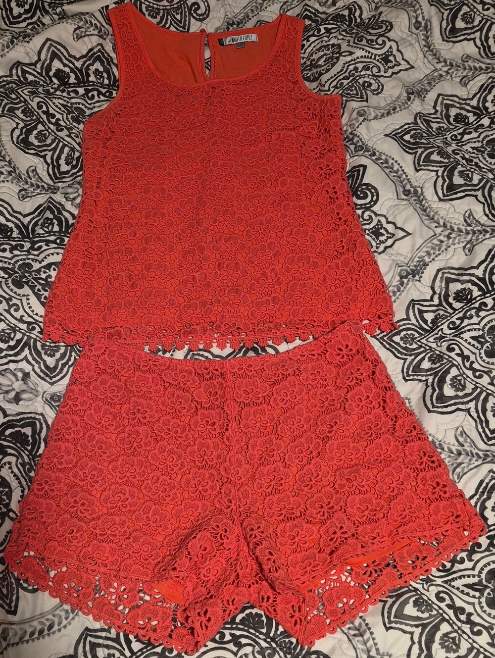 Jennifer Lopez (JLO) 2-Piece Crochet Lace Top and Shorts Set in a vibrant coral